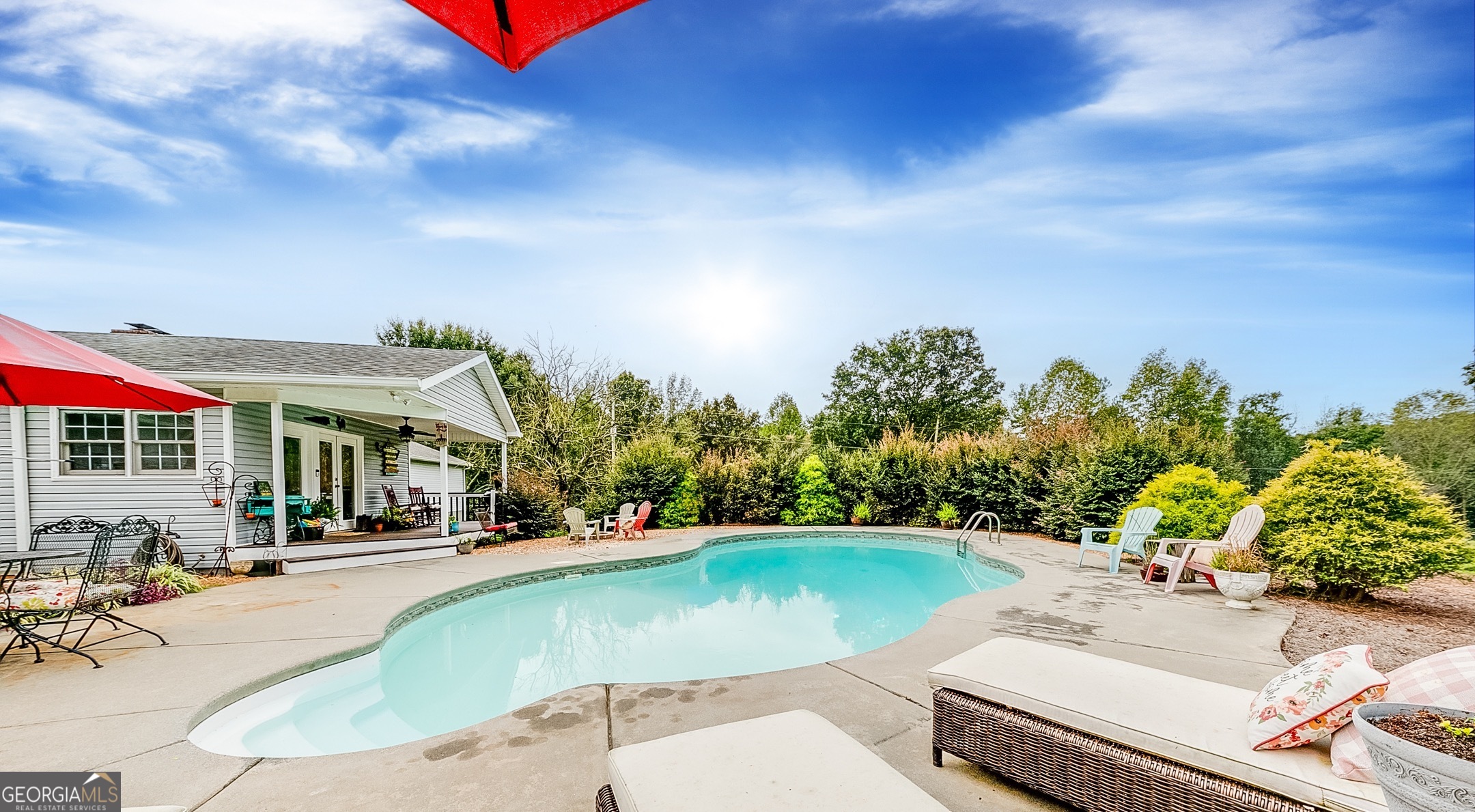 119 Yarbrough Ridgeway Road Commerce, GA 30529 - Photo 17 of 50 a view of a swimming pool with a patio