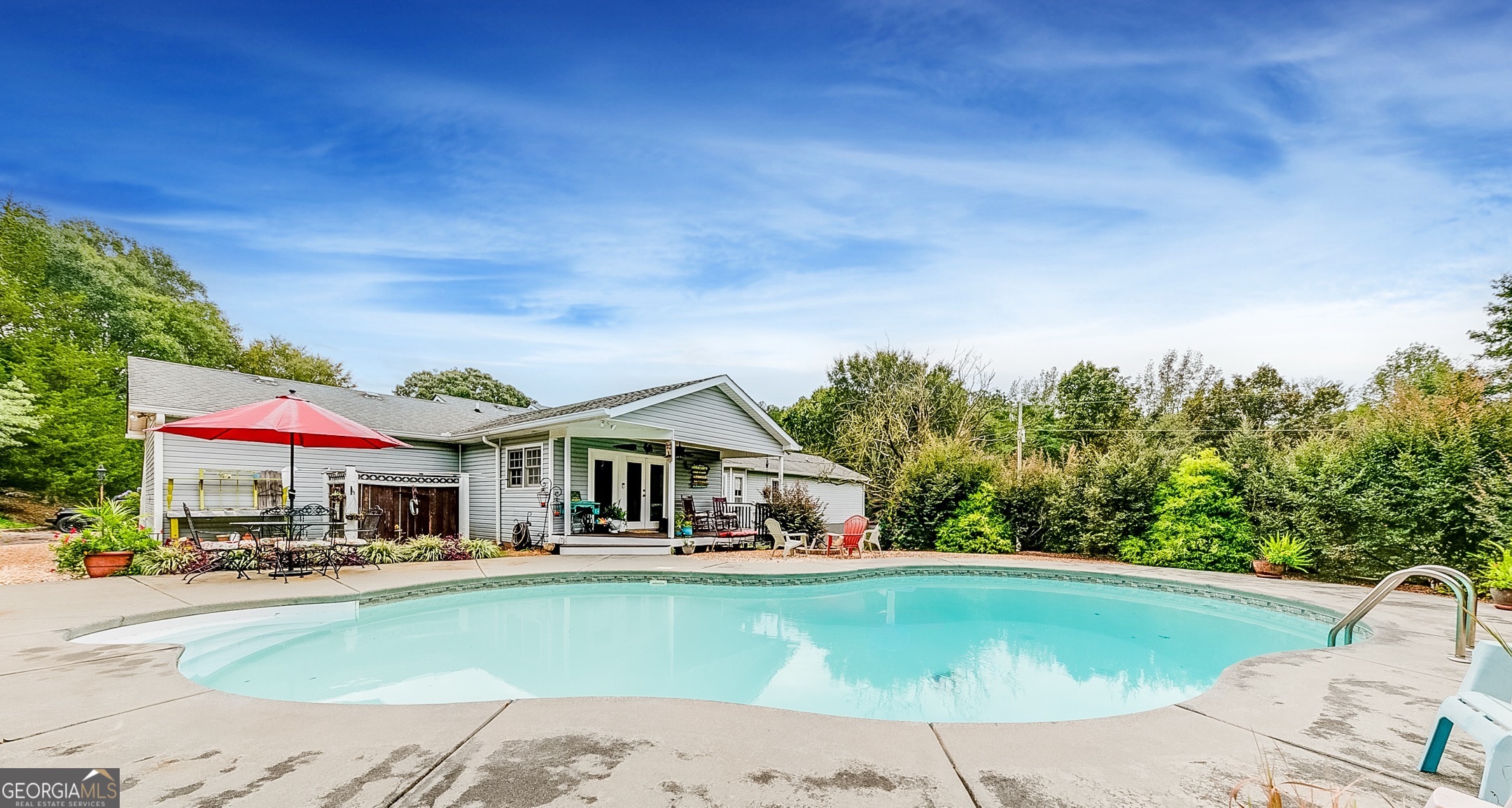 119 Yarbrough Ridgeway Road Commerce, GA 30529 - Photo 18 of 50 a front view of a house with swimming pool garden and patio