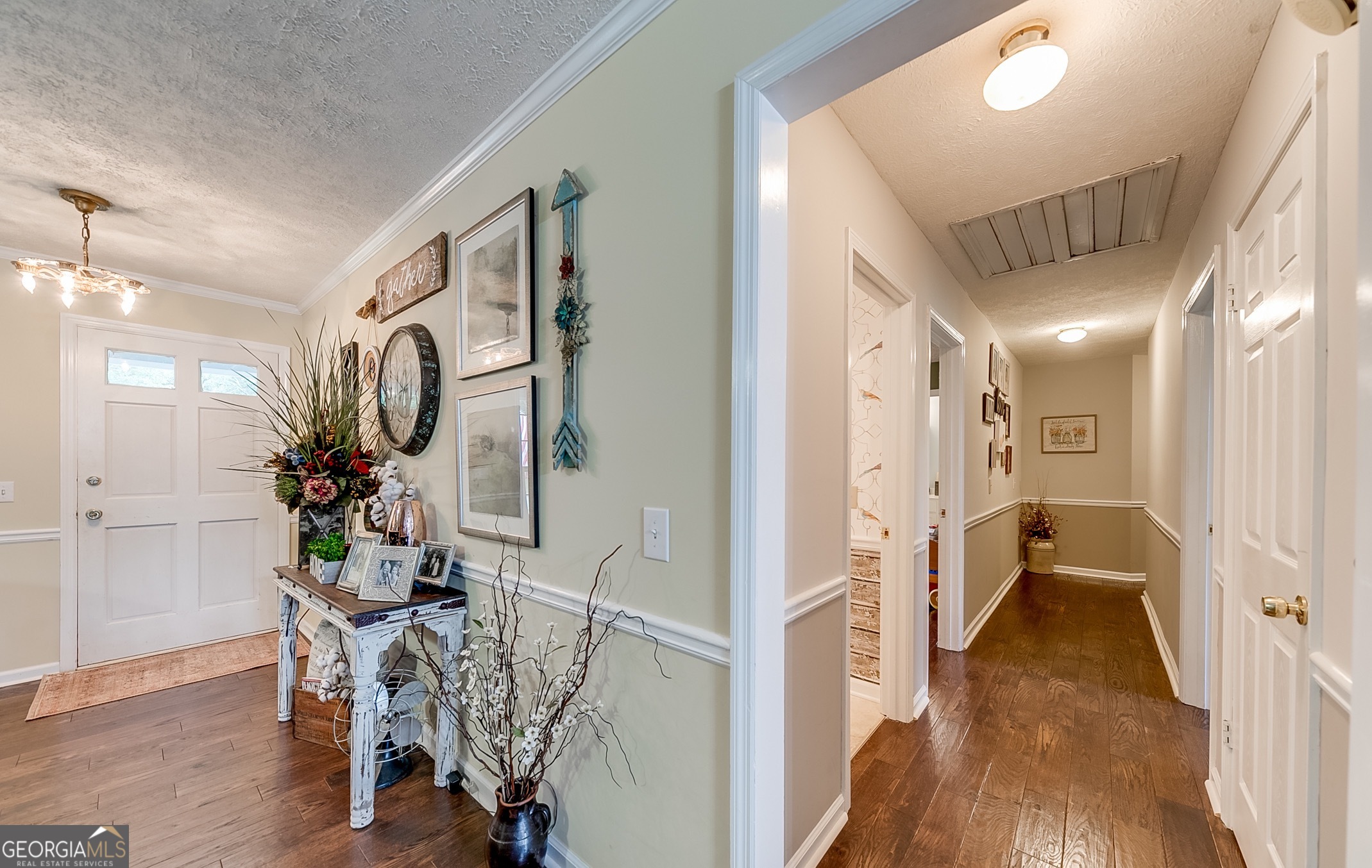 119 Yarbrough Ridgeway Road Commerce, GA 30529 - Photo 21 of 50 a view of a hallway with wooden floor windows and a livingroom