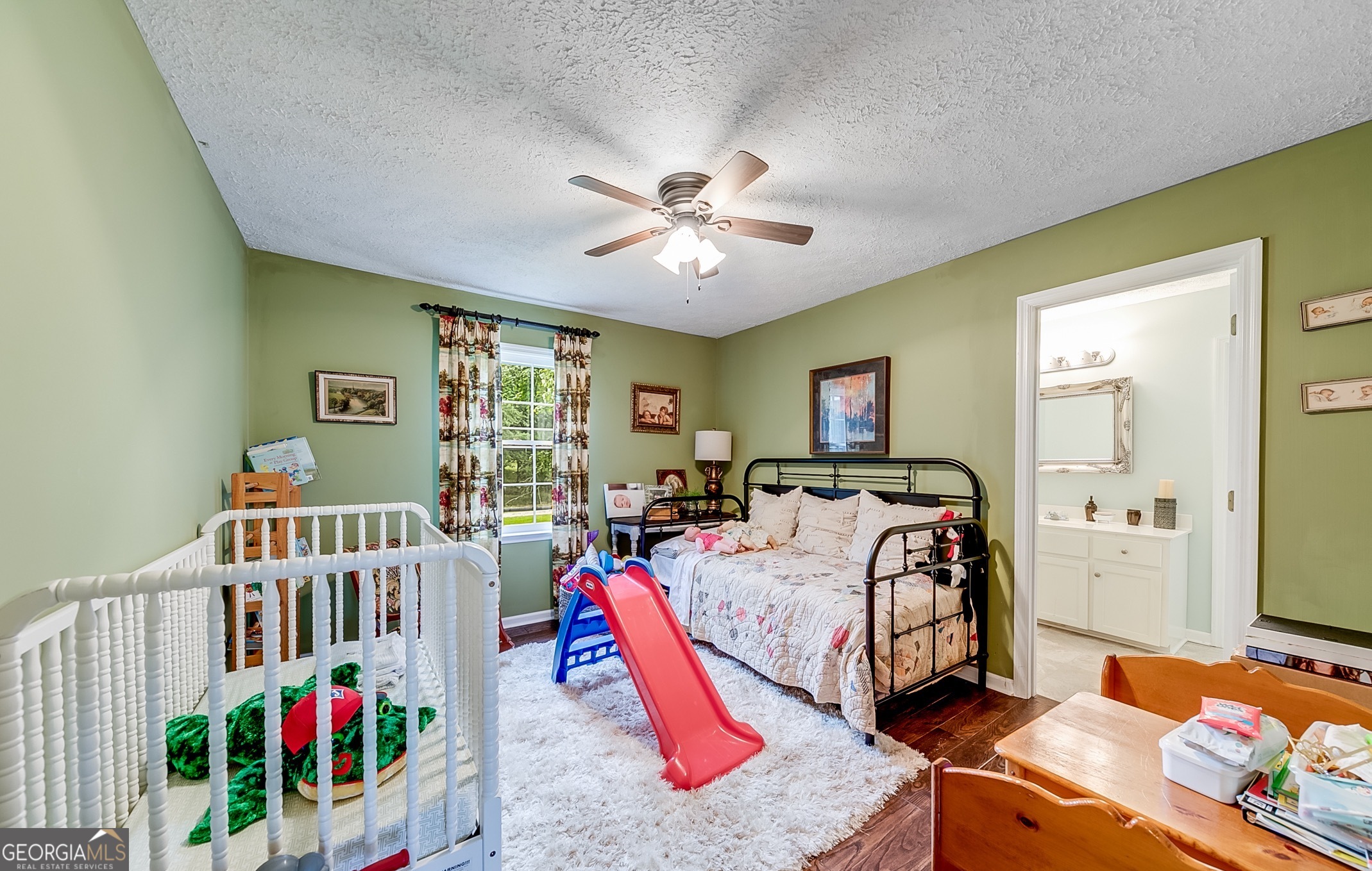 119 Yarbrough Ridgeway Road Commerce, GA 30529 - Photo 22 of 50 a bedroom with furniture and a large window