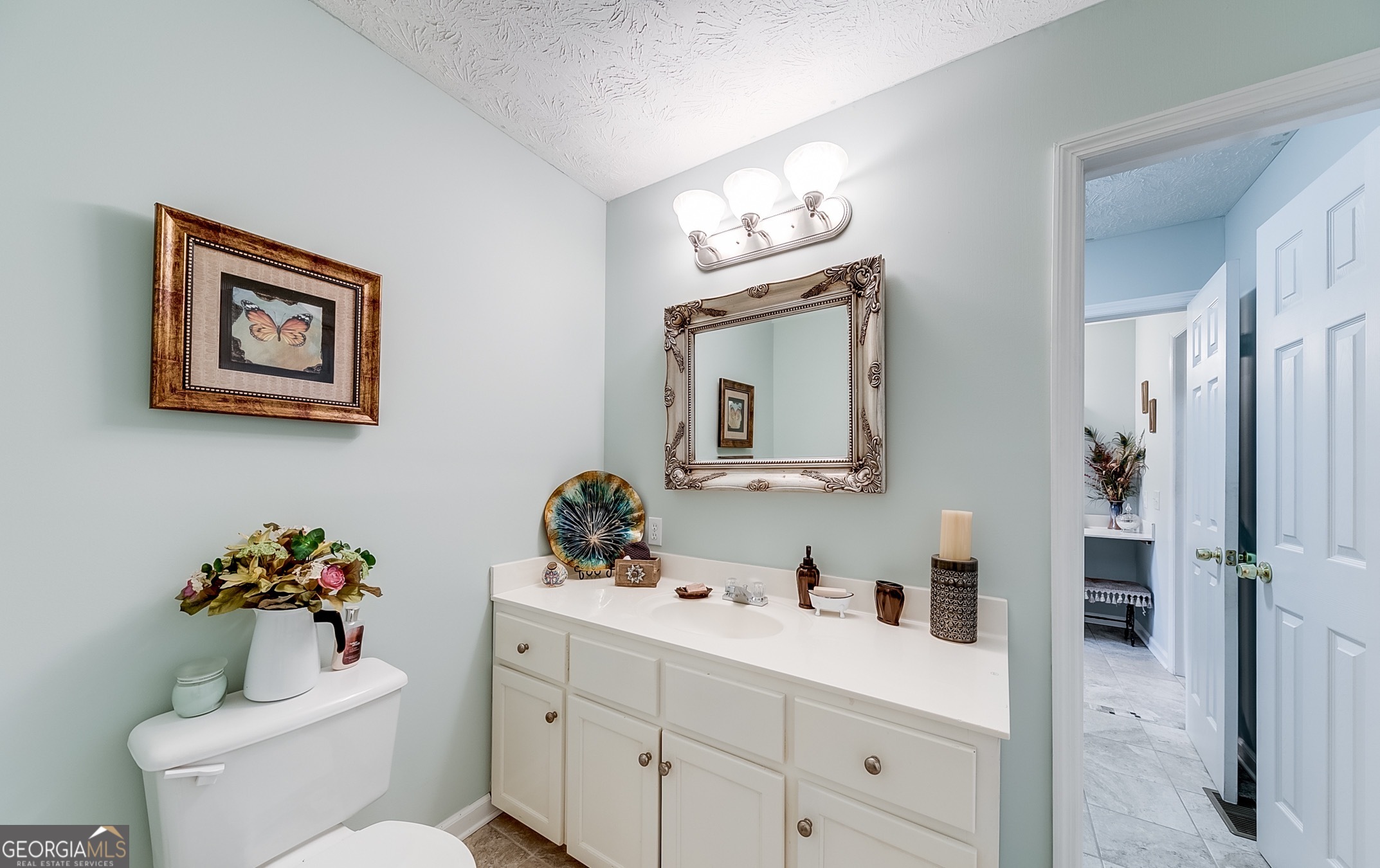 119 Yarbrough Ridgeway Road Commerce, GA 30529 - Photo 23 of 50 a bathroom with a toilet sink and mirror