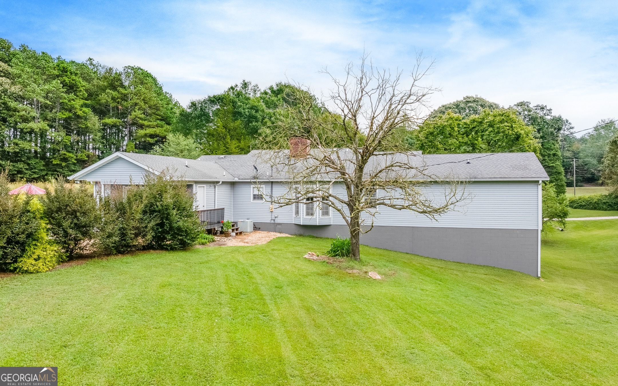 119 Yarbrough Ridgeway Road Commerce, GA 30529 - Photo 30 of 50 a view of a house with a yard and tree