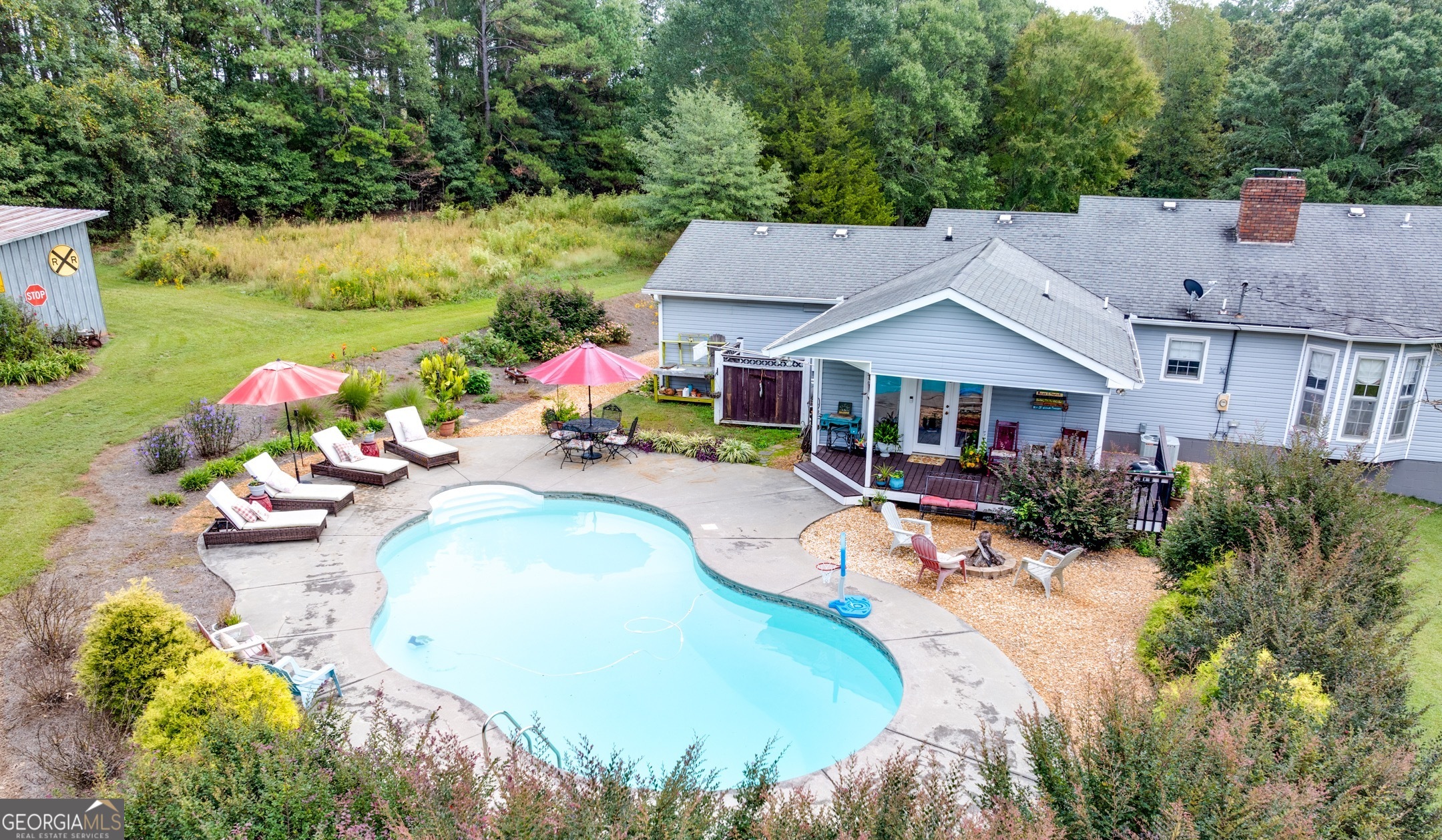119 Yarbrough Ridgeway Road Commerce, GA 30529 - Photo 31 of 50 a view of a house with swimming pool and a yard