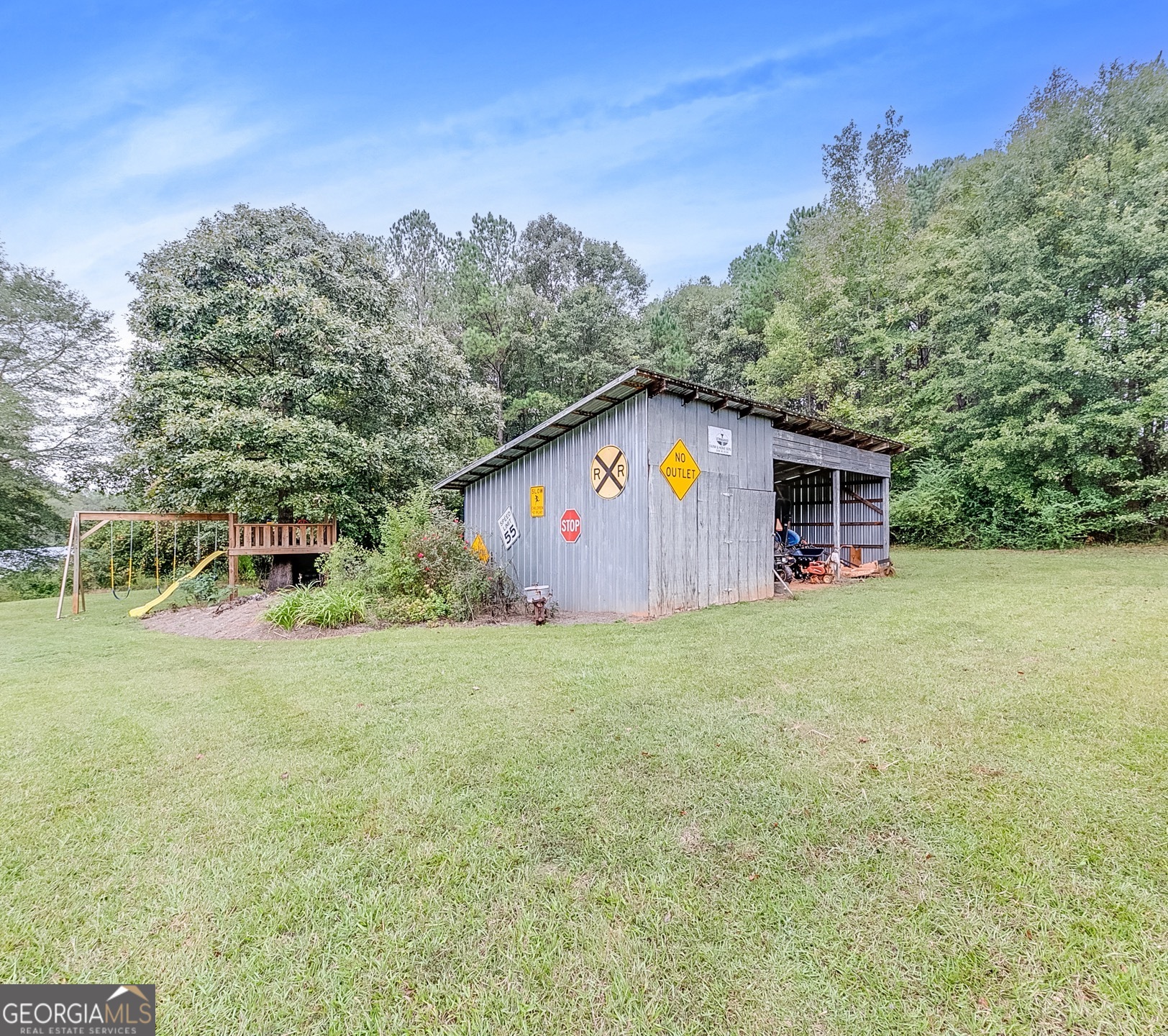 119 Yarbrough Ridgeway Road Commerce, GA 30529 - Photo 32 of 50 a backyard of a house with lots of green space