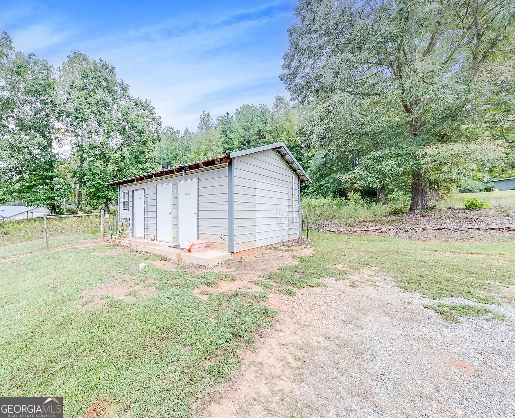 119 Yarbrough Ridgeway Road Commerce, GA 30529 - Photo 33 of 50 a backyard of a house with lots of green space