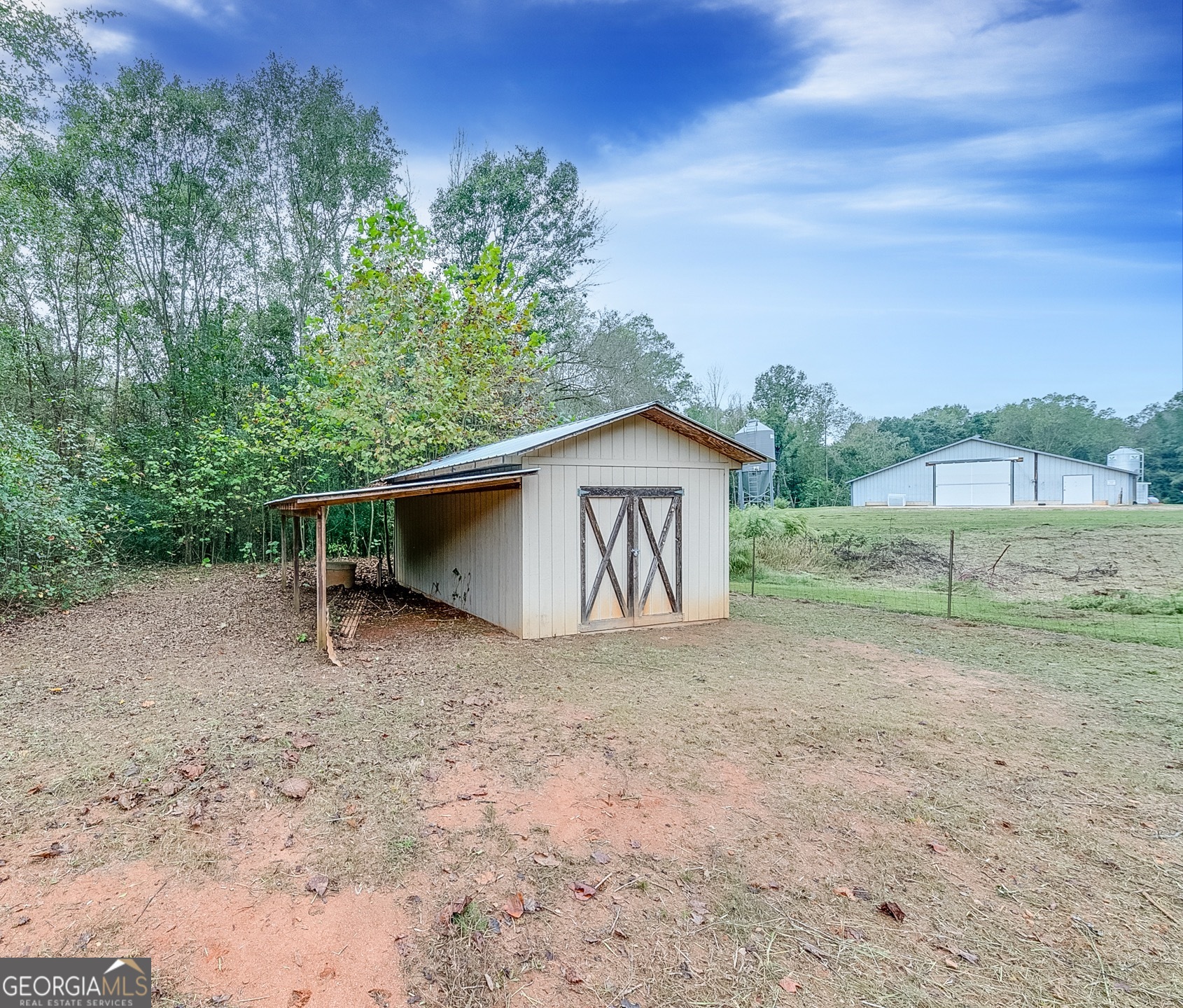 119 Yarbrough Ridgeway Road Commerce, GA 30529 - Photo 34 of 50 a backyard of a house with lots of green space