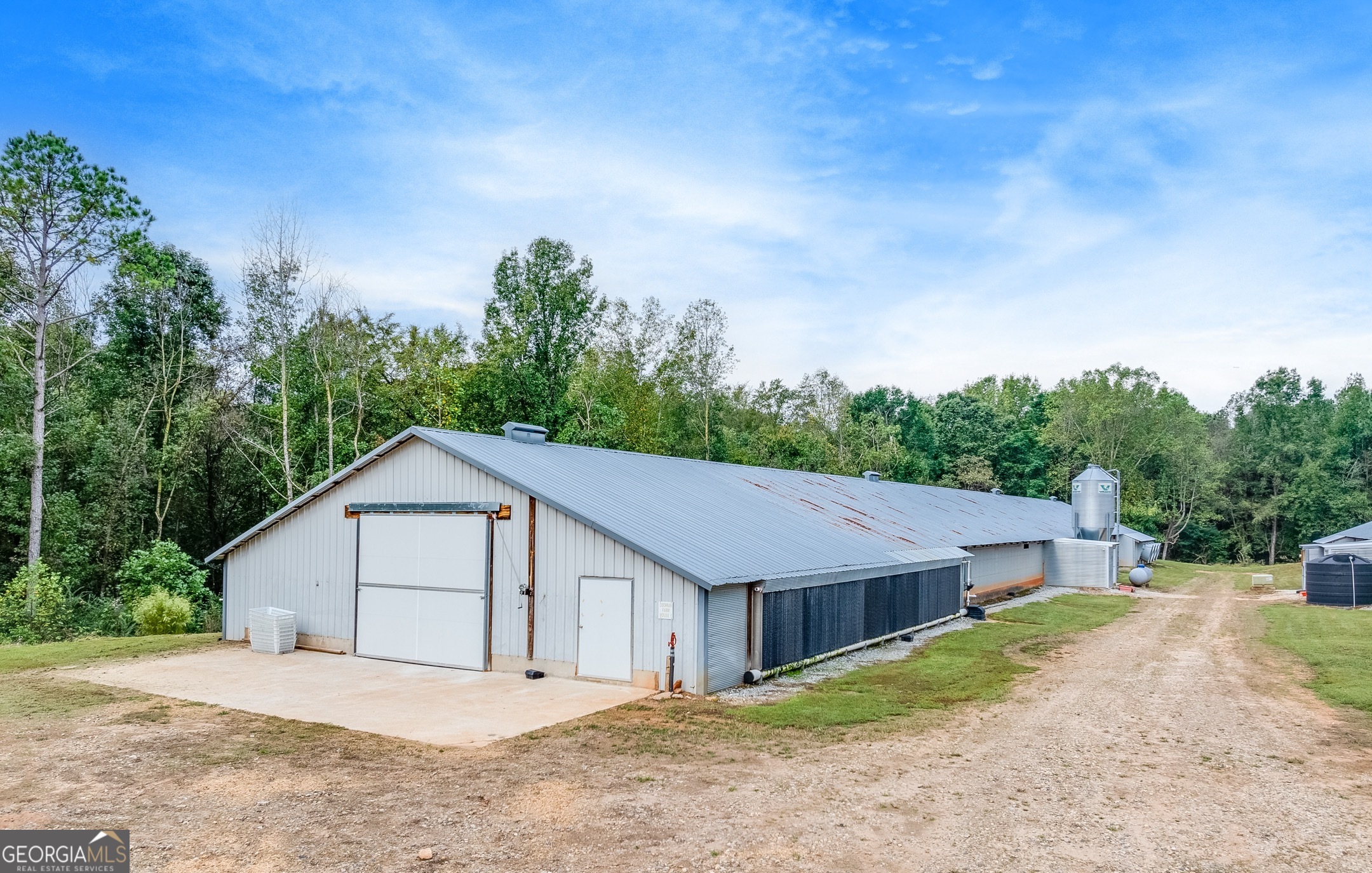 119 Yarbrough Ridgeway Road Commerce, GA 30529 - Photo 36 of 50 a house with trees in the background