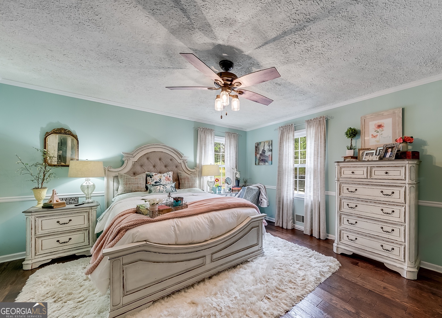 119 Yarbrough Ridgeway Road Commerce, GA 30529 - Photo 9 of 50 a bedroom with a bed and wooden floor