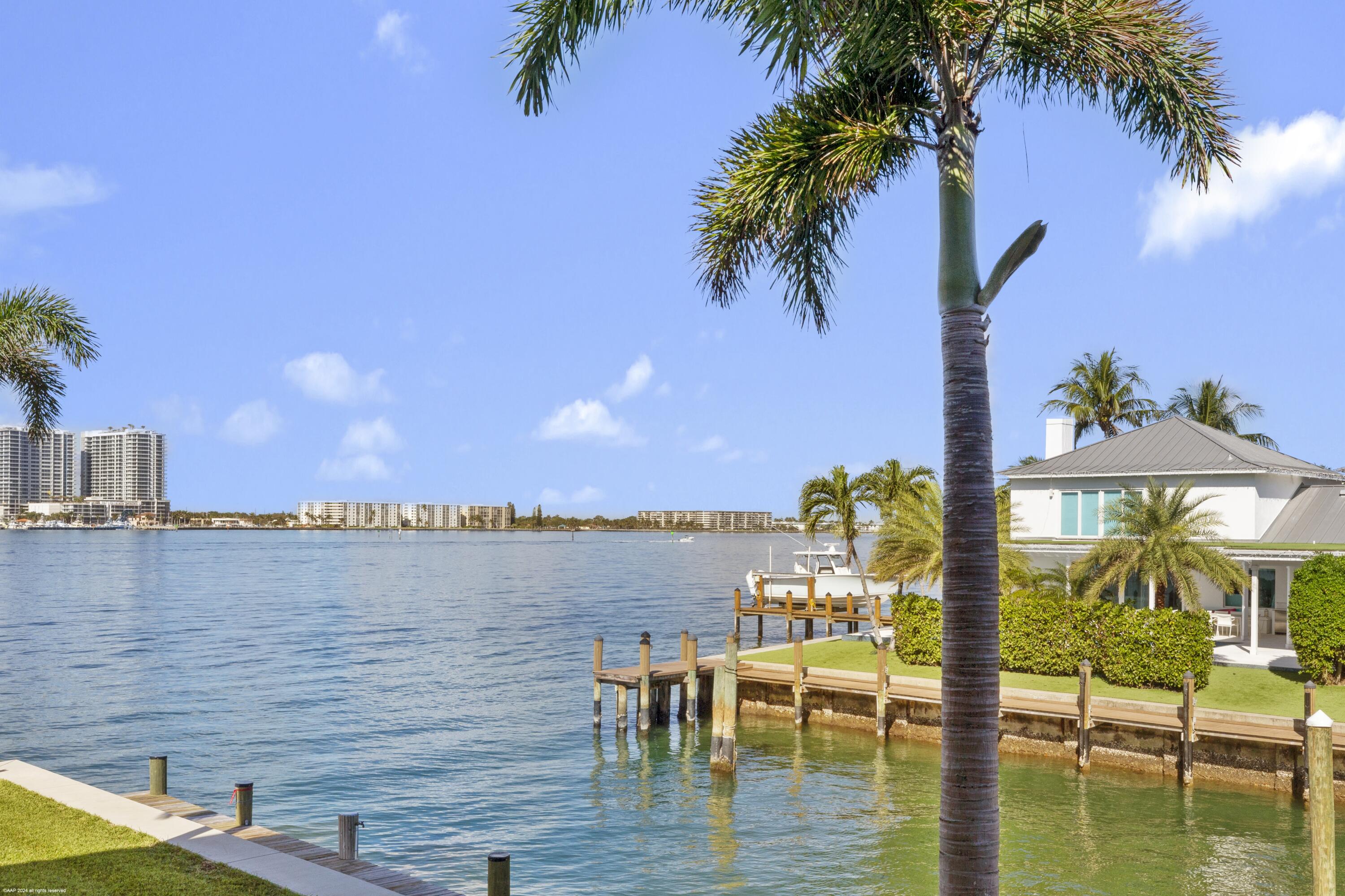 1030 Sugar Sands Boulevard, Unit 267 Singer Island, FL 33404 - Photo 11 of 51 a view of a lake with outdoor seating