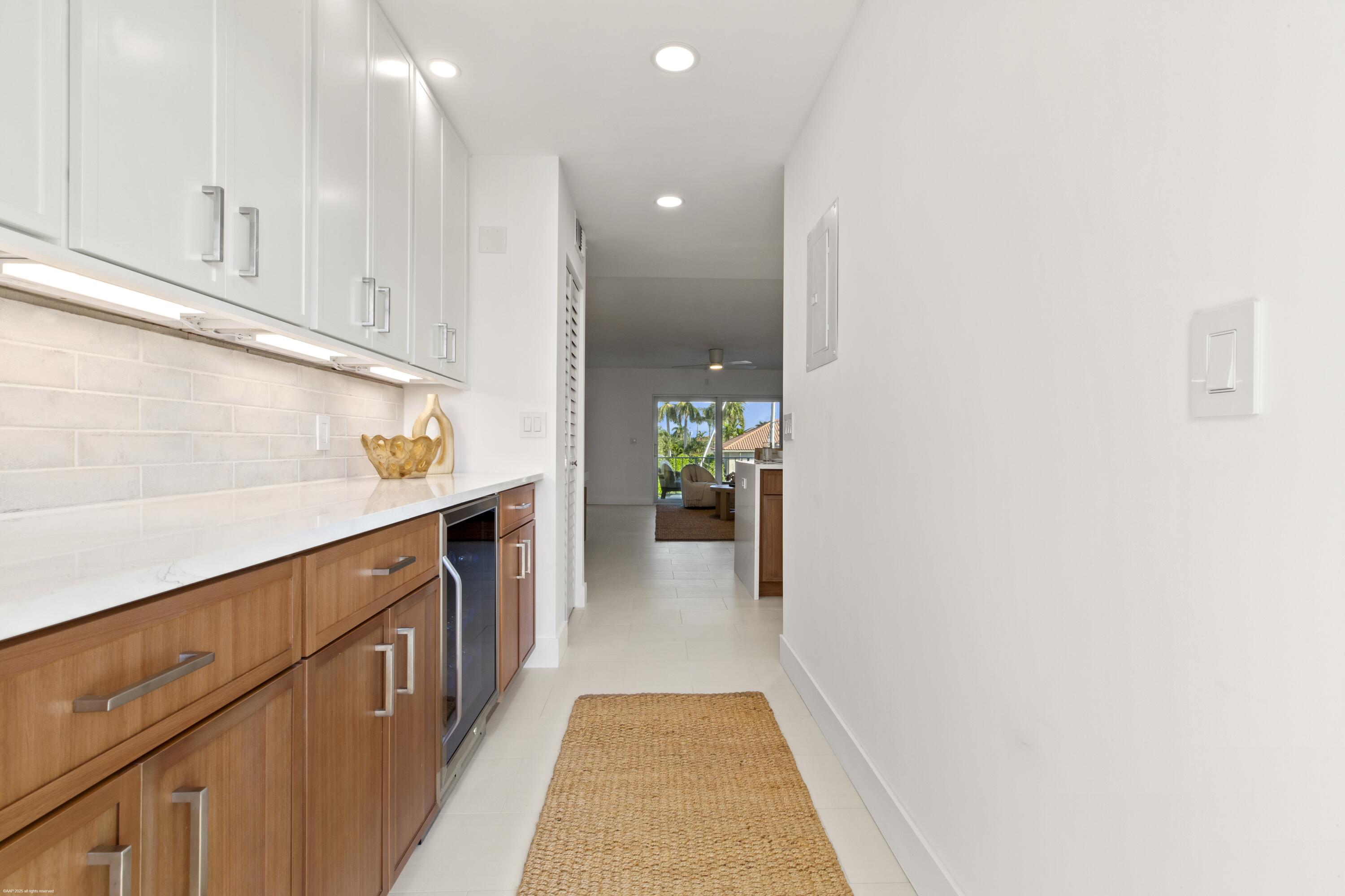 1030 Sugar Sands Boulevard, Unit 267 Singer Island, FL 33404 - Photo 12 of 51 a view of hallway with wooden floor