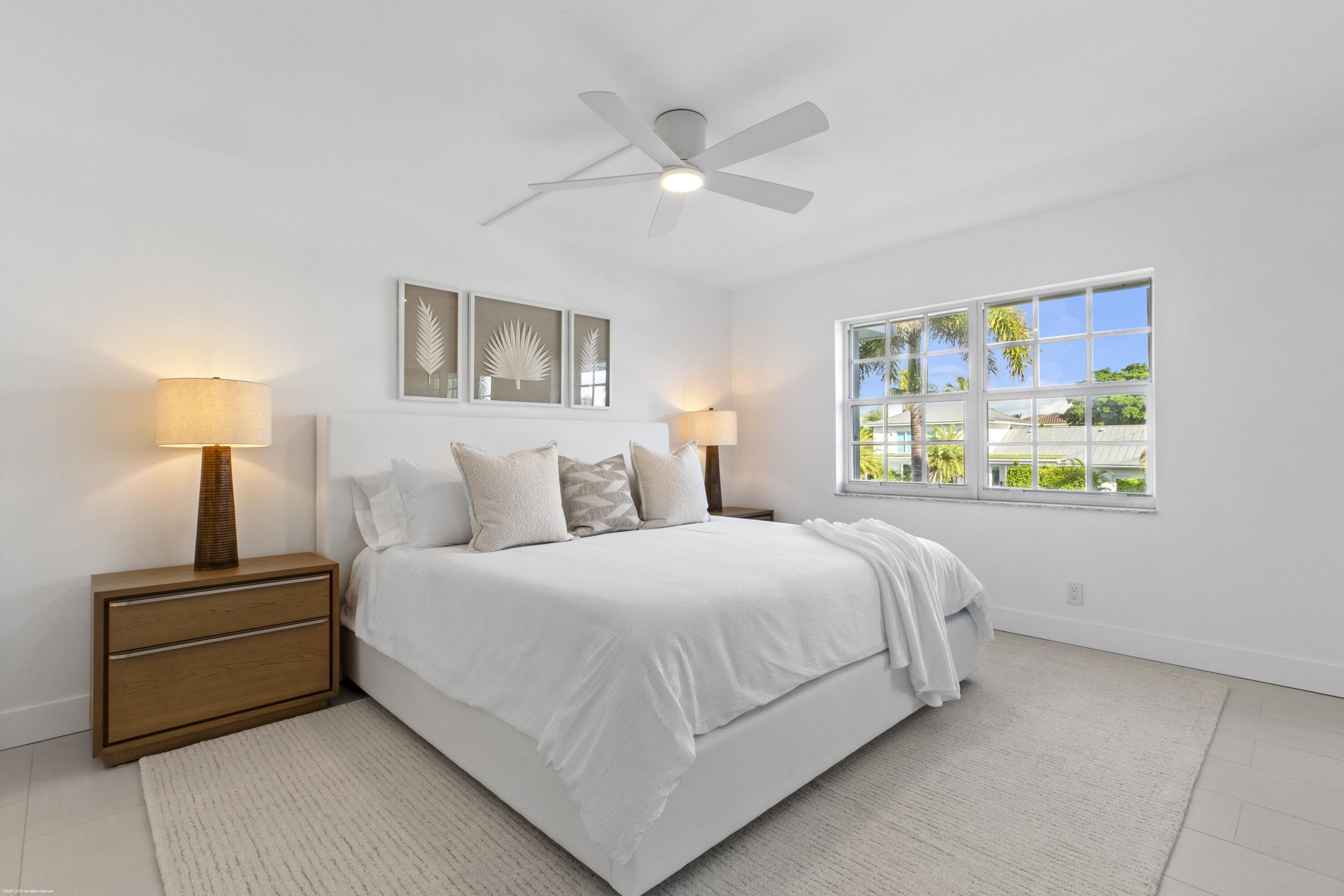 1030 Sugar Sands Boulevard, Unit 267 Singer Island, FL 33404 - Photo 26 of 51 a bedroom with bed and window