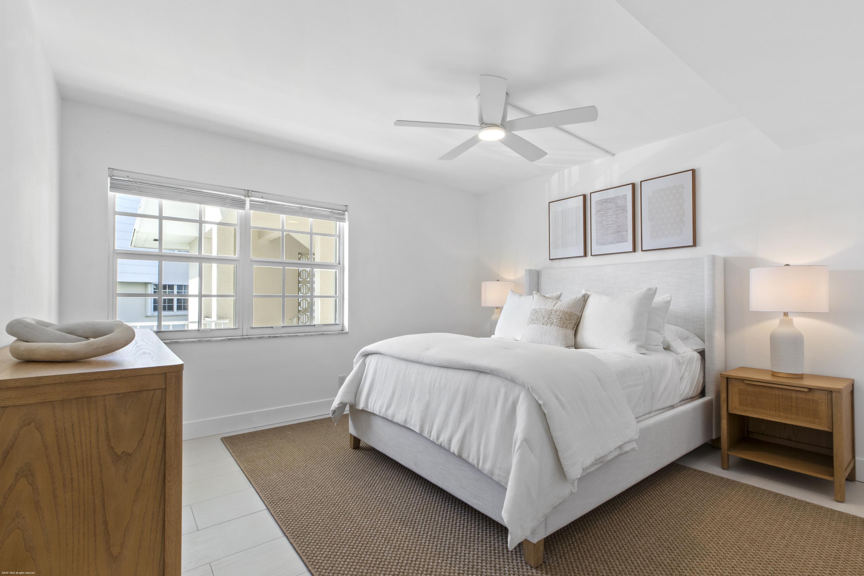 1030 Sugar Sands Boulevard, Unit 267 Singer Island, FL 33404 - Photo 32 of 51 a bedroom with a bed and window