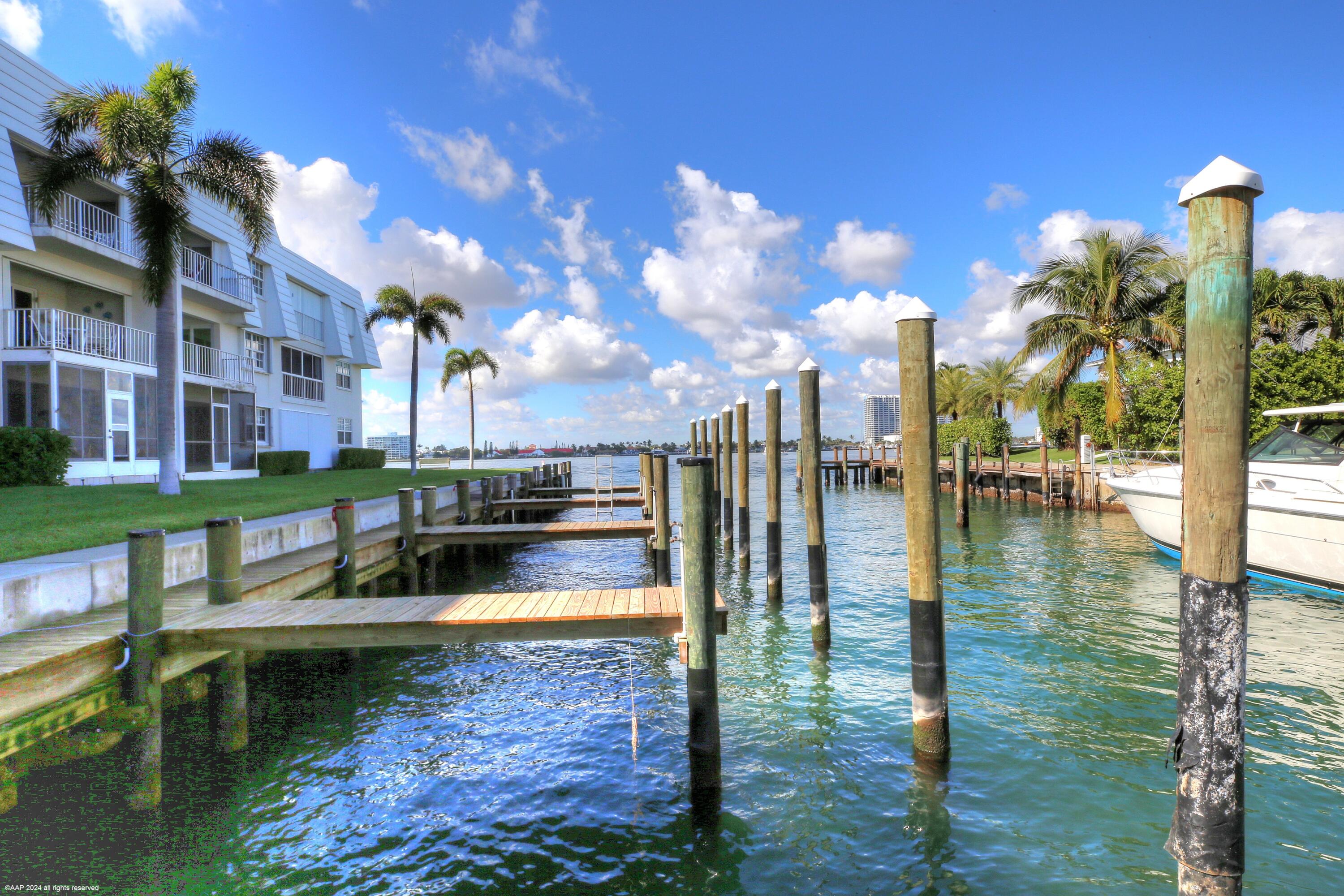 1030 Sugar Sands Boulevard, Unit 267 Singer Island, FL 33404 - Photo 7 of 51 a view of a lake with a house