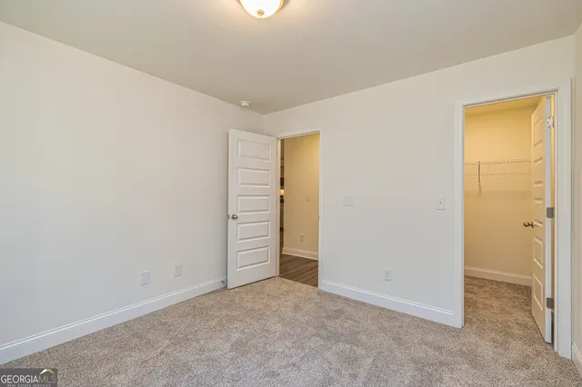 an empty room with closet area