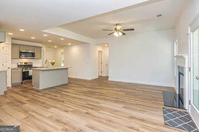 a view of a kitchen with a sink and a kitchen view