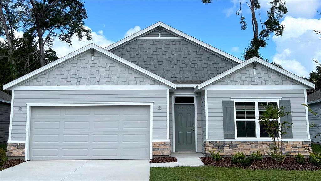 5326 Southwest 52nd Avenue Gainesville, FL 32608 - Photo 1 of 1 a front view of a house with a yard