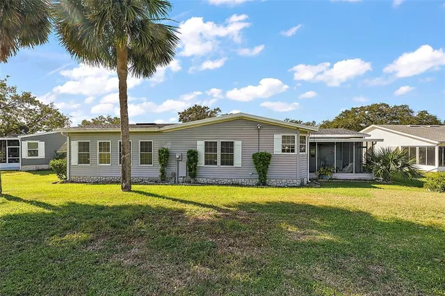 a front view of a house with swimming pool having outdoor seating