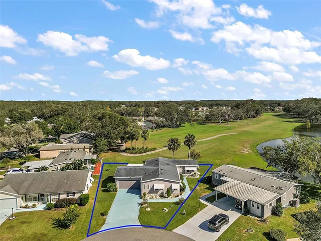 an aerial view of a city with lake view