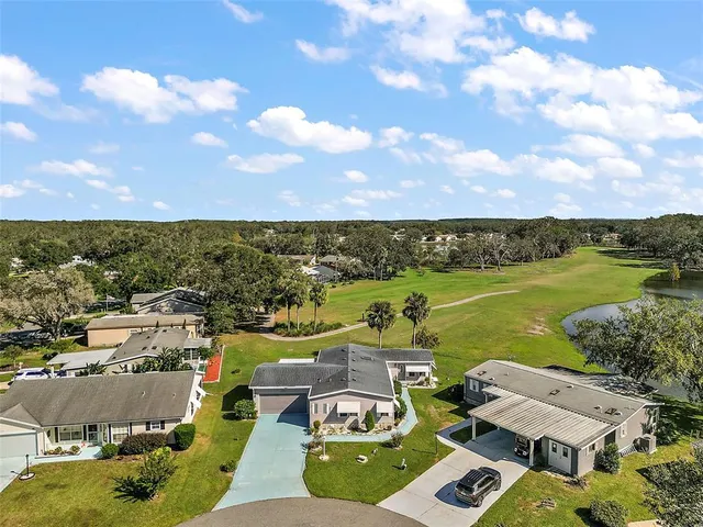 an aerial view of a house with a lake view