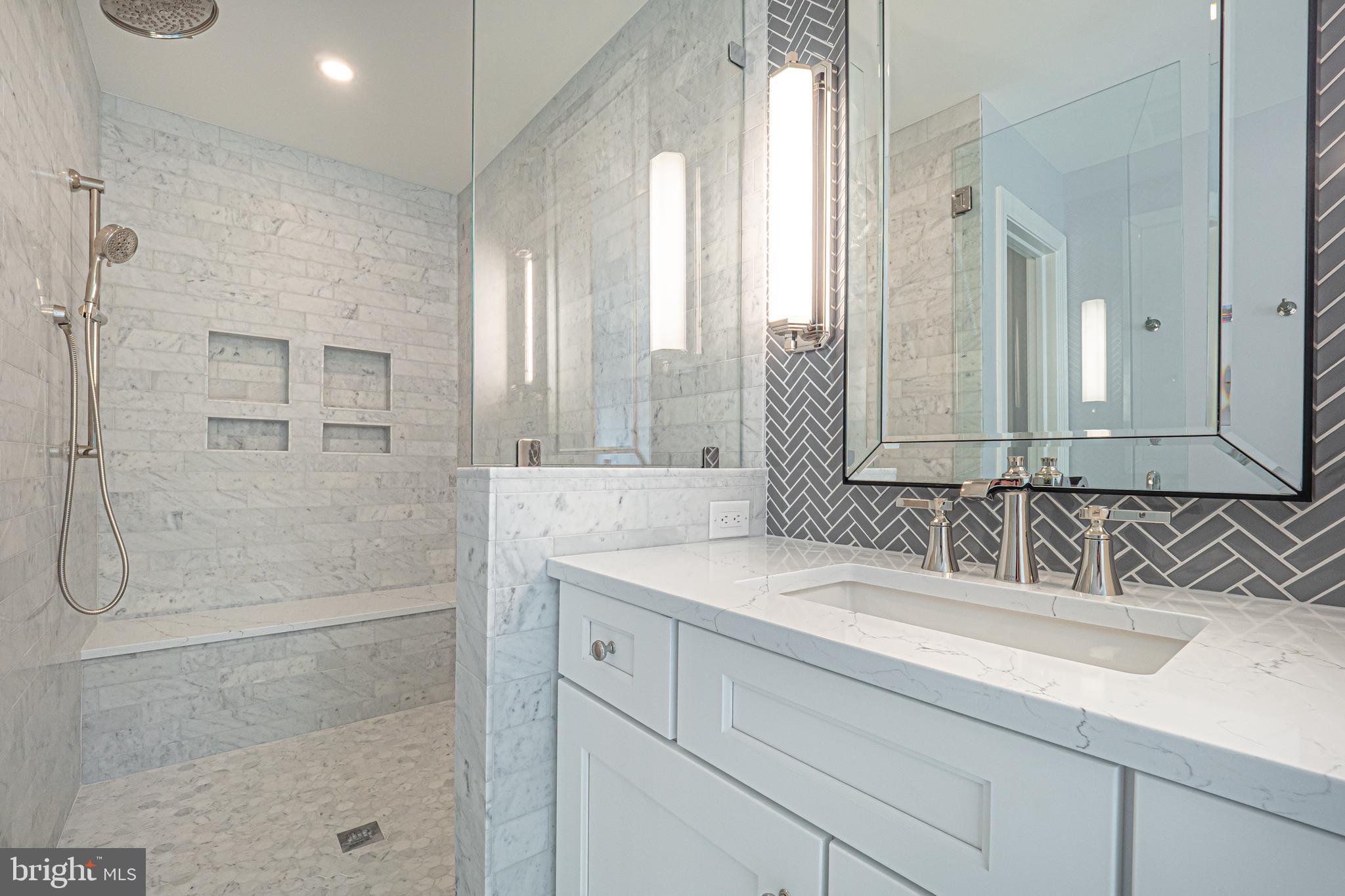 2 Timber Mill Lane, Unit SERENO Landenberg, PA 19350 - Photo 30 of 62 a bathroom with a shower sink and mirror