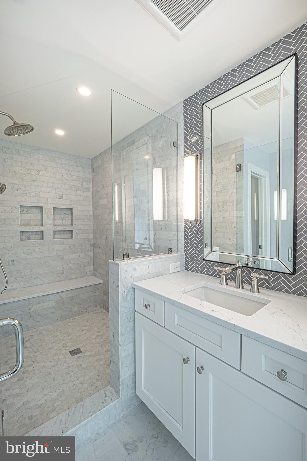 2 Timber Mill Lane, Unit SERENO Landenberg, PA 19350 - Photo 34 of 62 a bathroom with a double vanity sink mirror and shower