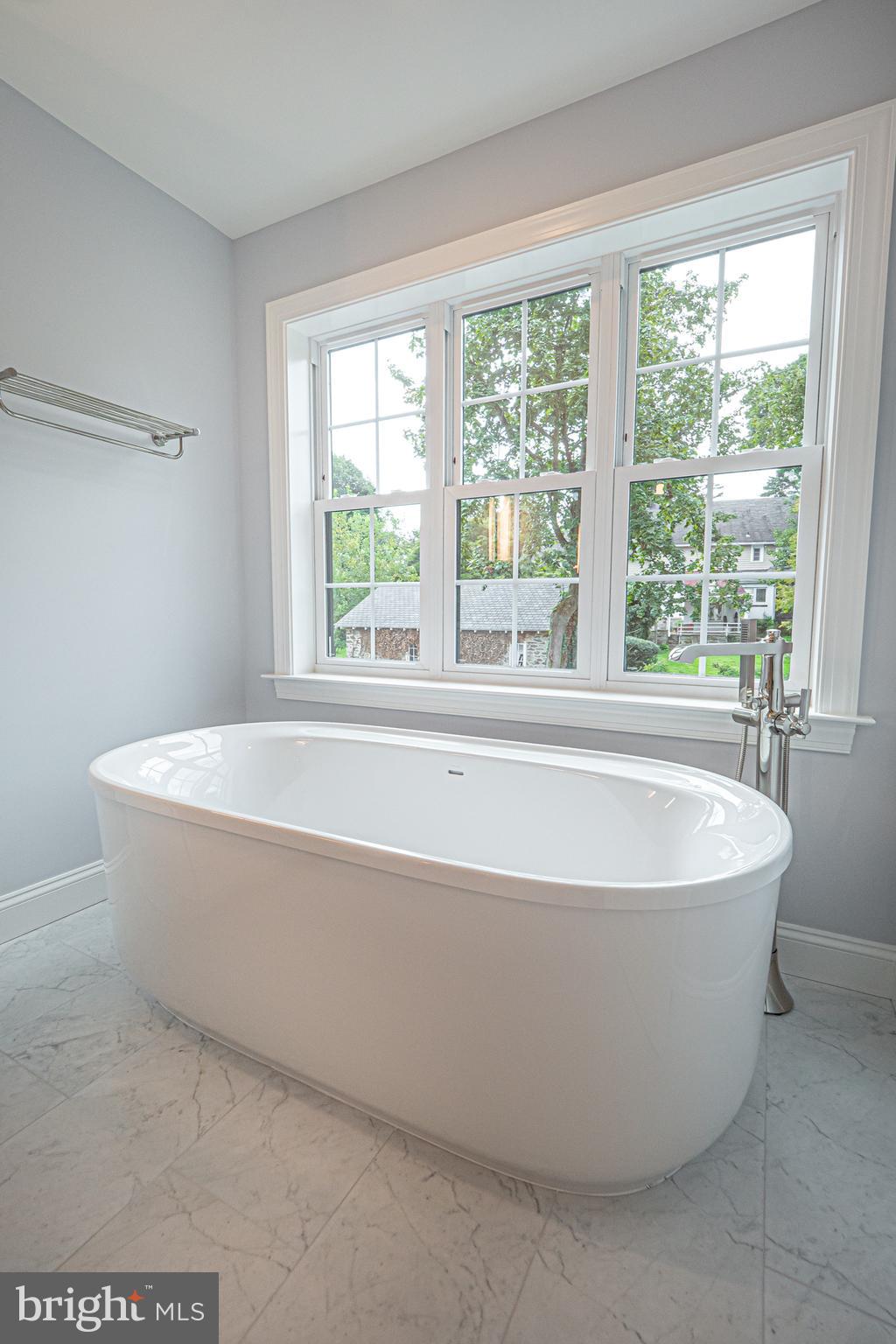 2 Timber Mill Lane, Unit SERENO Landenberg, PA 19350 - Photo 37 of 62 a white bath tub sitting in a bathroom