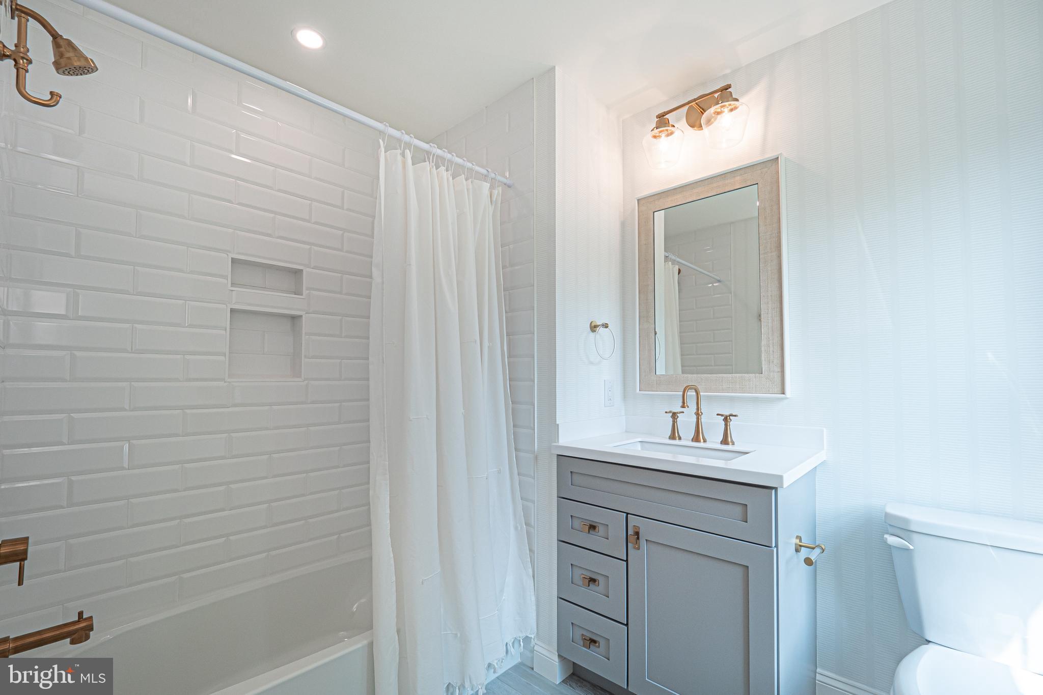 2 Timber Mill Lane, Unit SERENO Landenberg, PA 19350 - Photo 47 of 62 a bathroom with a sink a toilet and shower