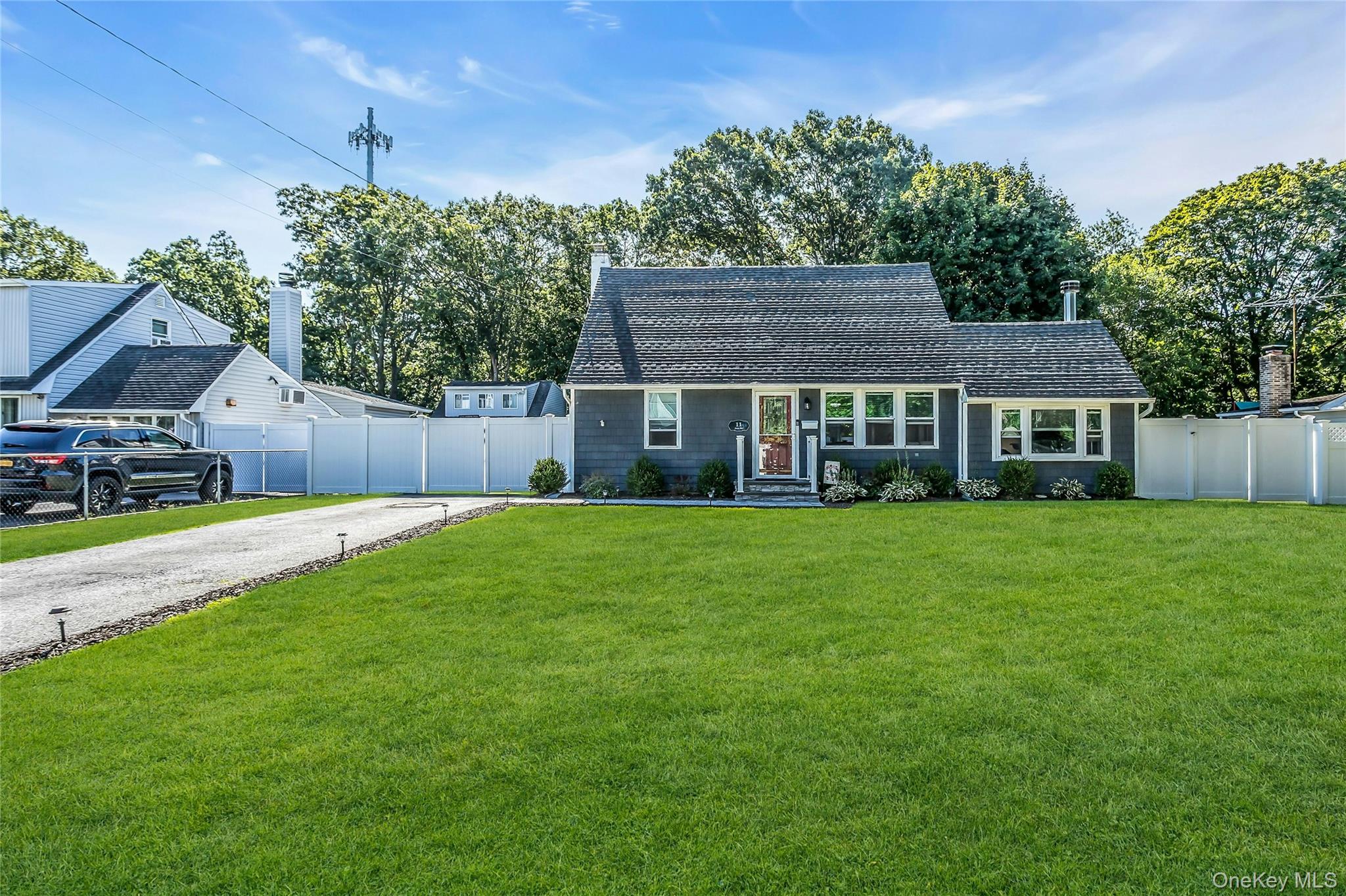 11 Joan Road Bay Shore, NY 11706 - Photo 1 of 1 View of front of home Multi-car driveway