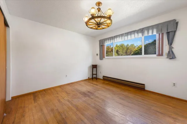 a view of a park with swings and slides