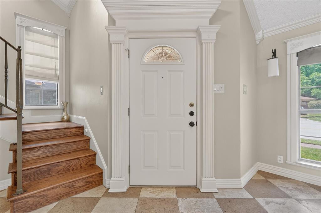 272 Lodge Road Coppell, TX 75019 - Photo 3 of 24 a view of a hallway with wooden floor and windows