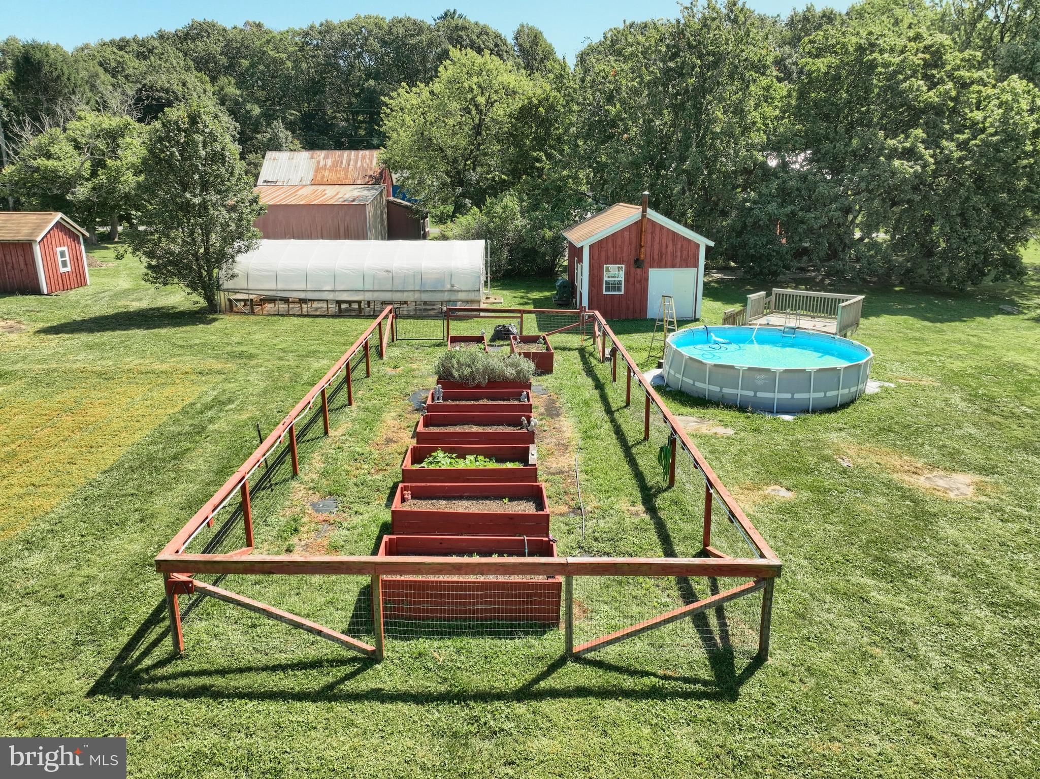456 Church Road Orrtanna, PA 17353 - Photo 11 of 65 a front view of a house with swimming pool table and chairs