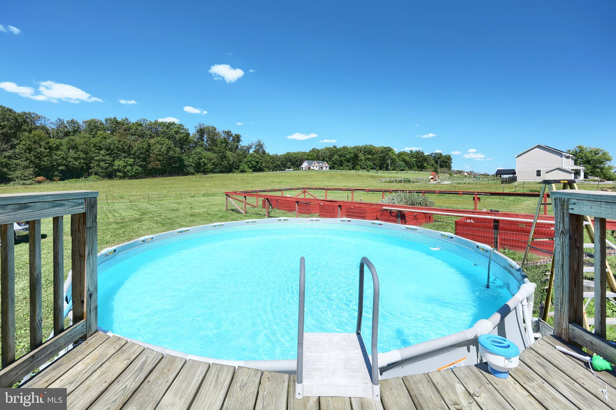 456 Church Road Orrtanna, PA 17353 - Photo 12 of 65 a view of a wooden deck and a yard
