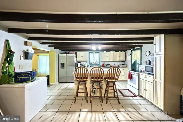 a patio with patio lots of furniture and umbrella