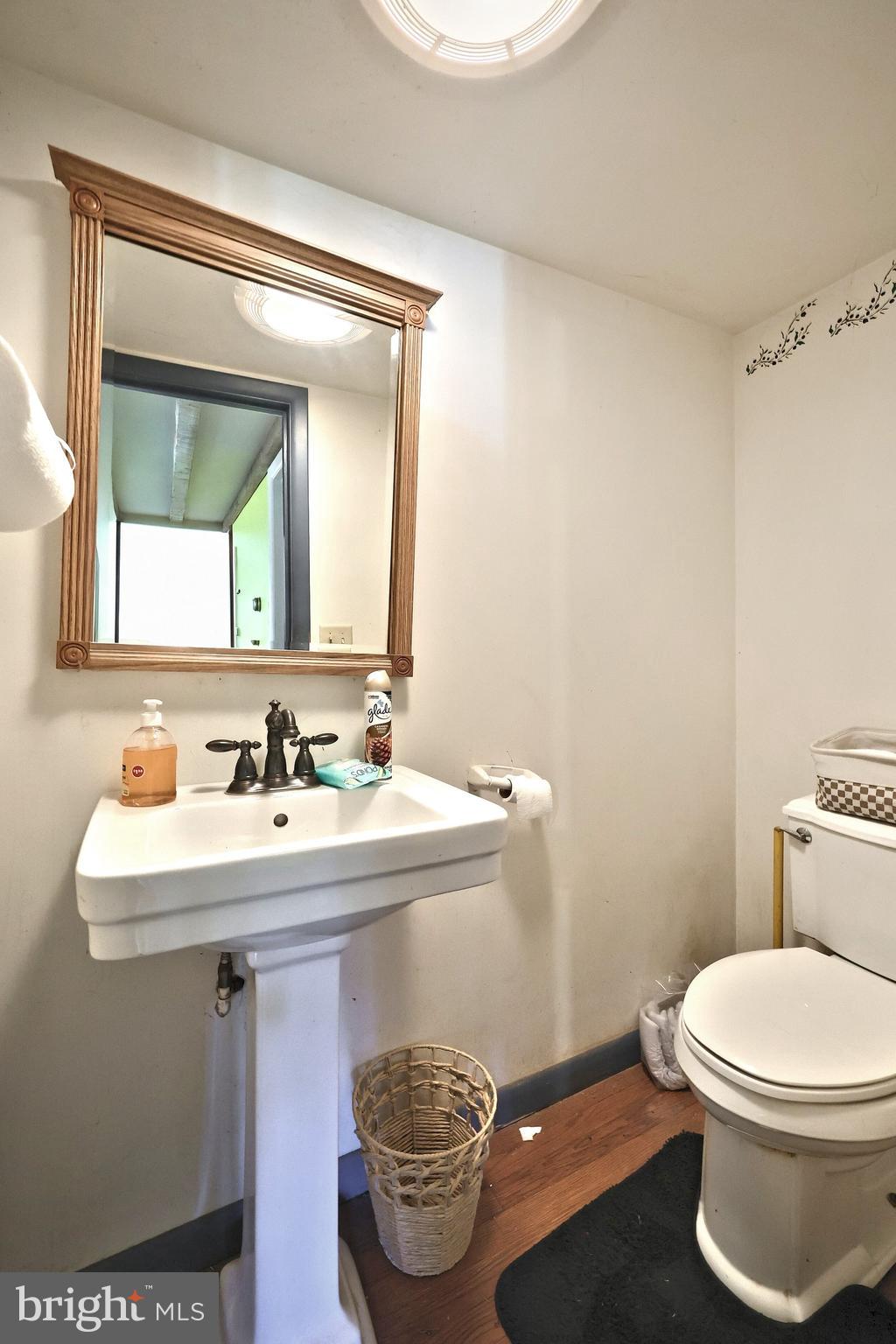 456 Church Road Orrtanna, PA 17353 - Photo 38 of 65 a bathroom with a sink toilet and mirror