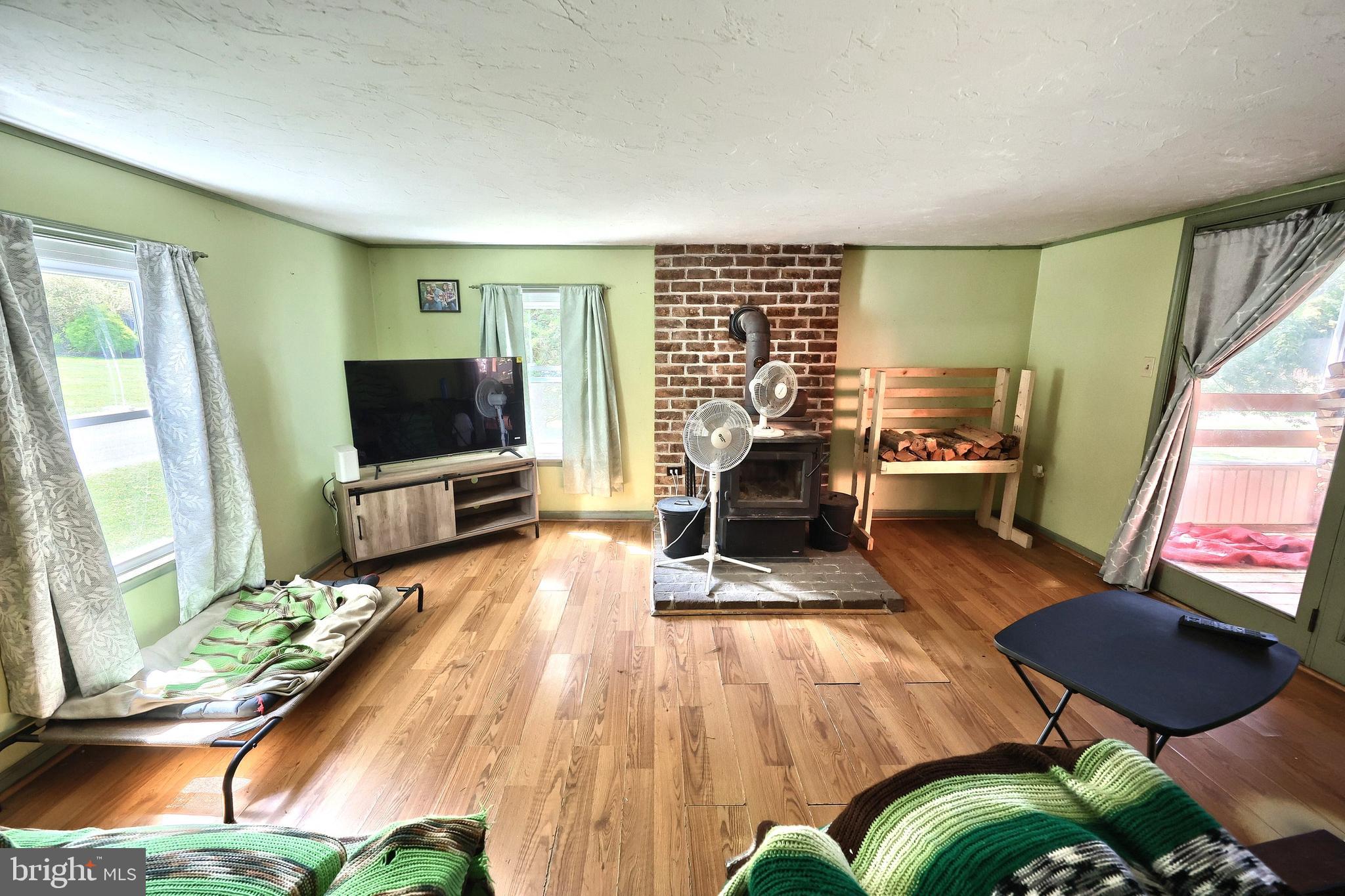 456 Church Road Orrtanna, PA 17353 - Photo 39 of 65 a living room with furniture and a flat screen tv