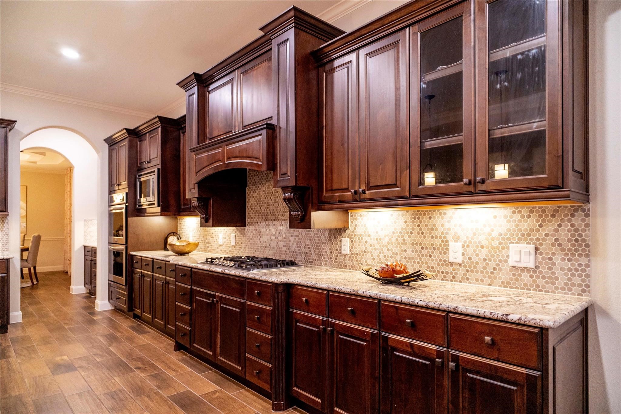 2727 Richmond Ridge Lane Katy, TX 77494 - Photo 11 of 50 a kitchen with granite countertop stainless steel appliances and wooden cabinets
