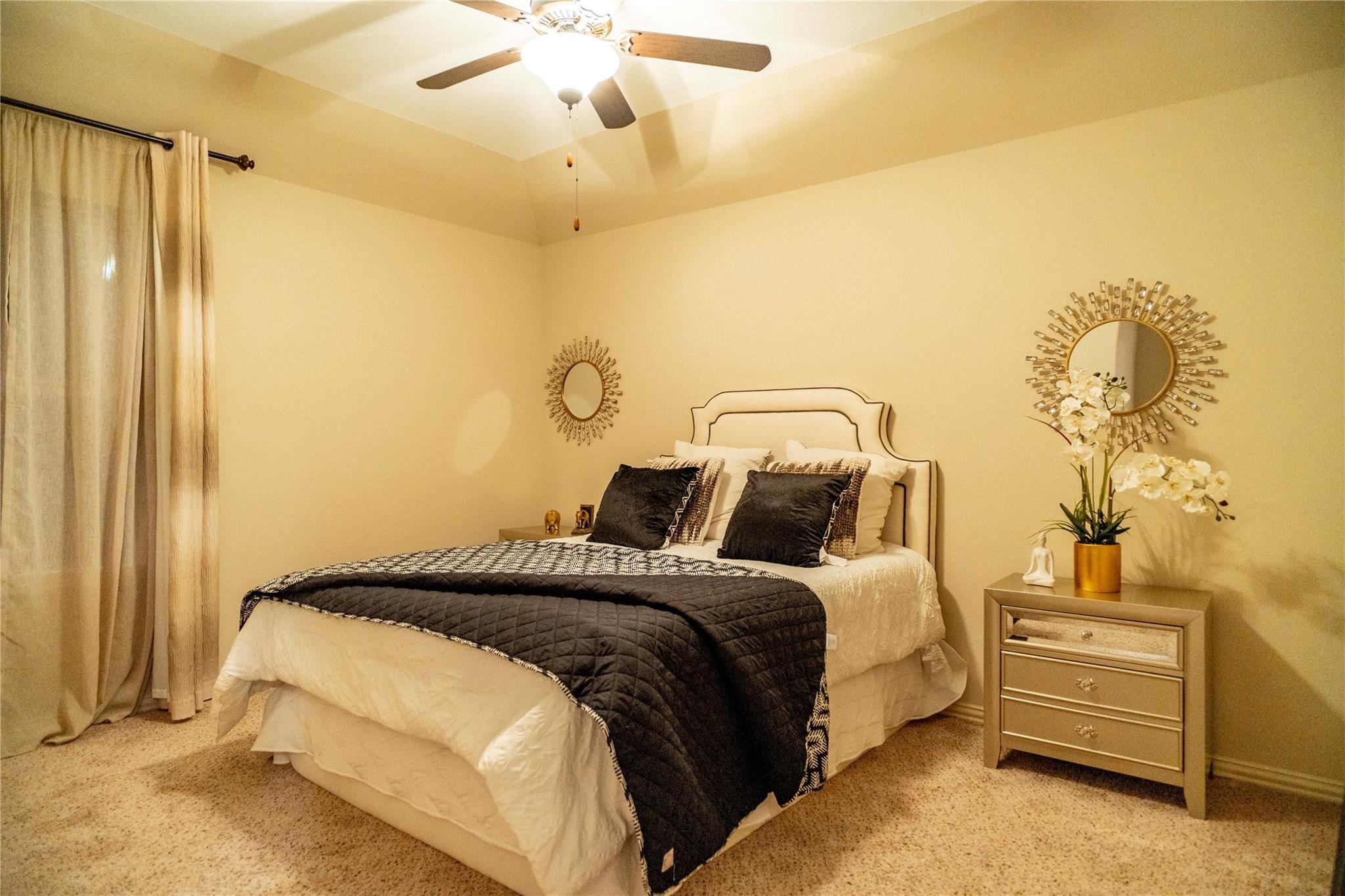 2727 Richmond Ridge Lane Katy, TX 77494 - Photo 31 of 50 a bedroom with a bed and a chandelier