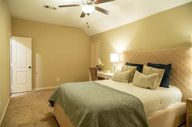 a bedroom with a bed and wall painting