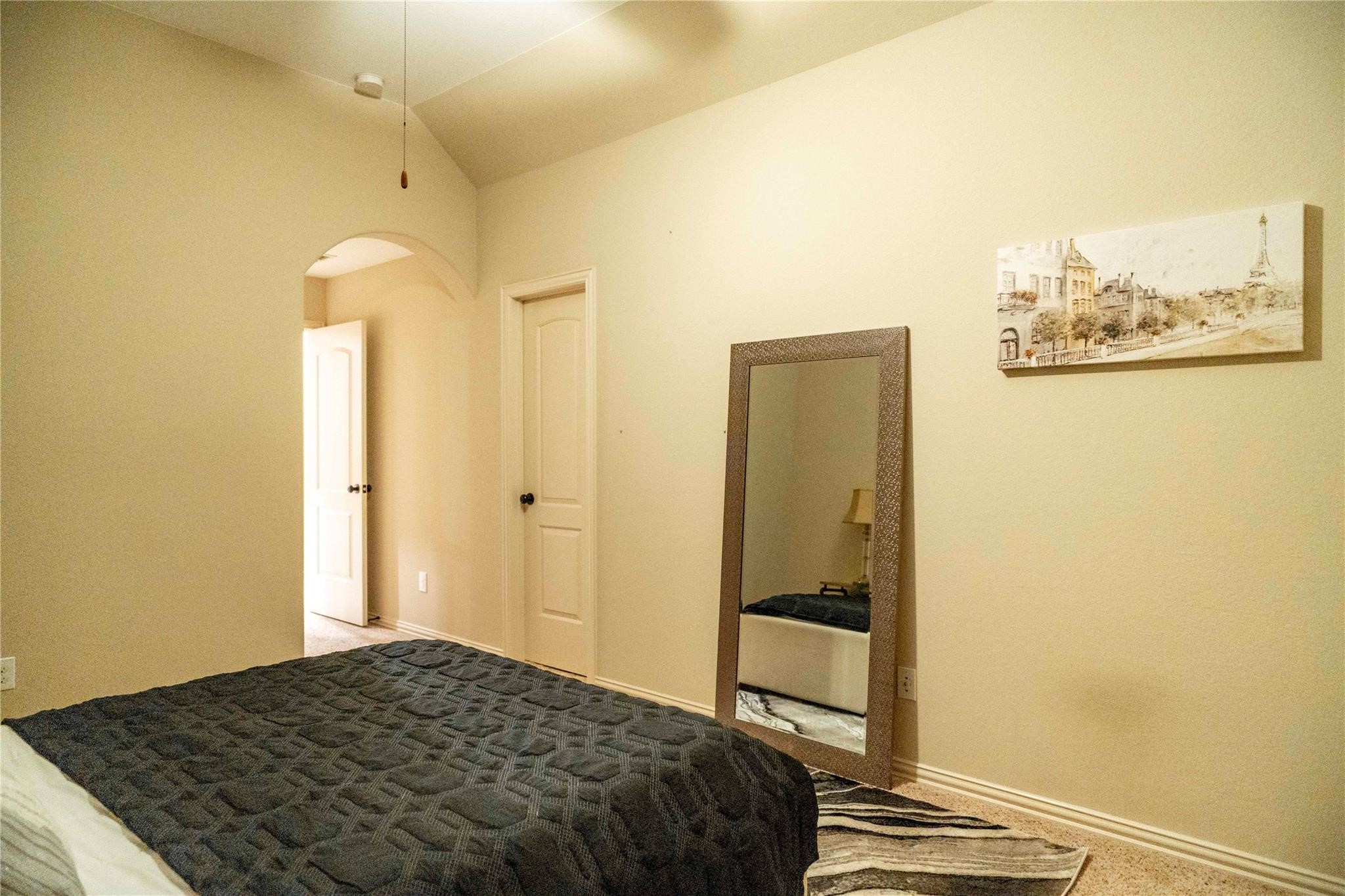 2727 Richmond Ridge Lane Katy, TX 77494 - Photo 35 of 50 a bedroom with a bed and wall painting