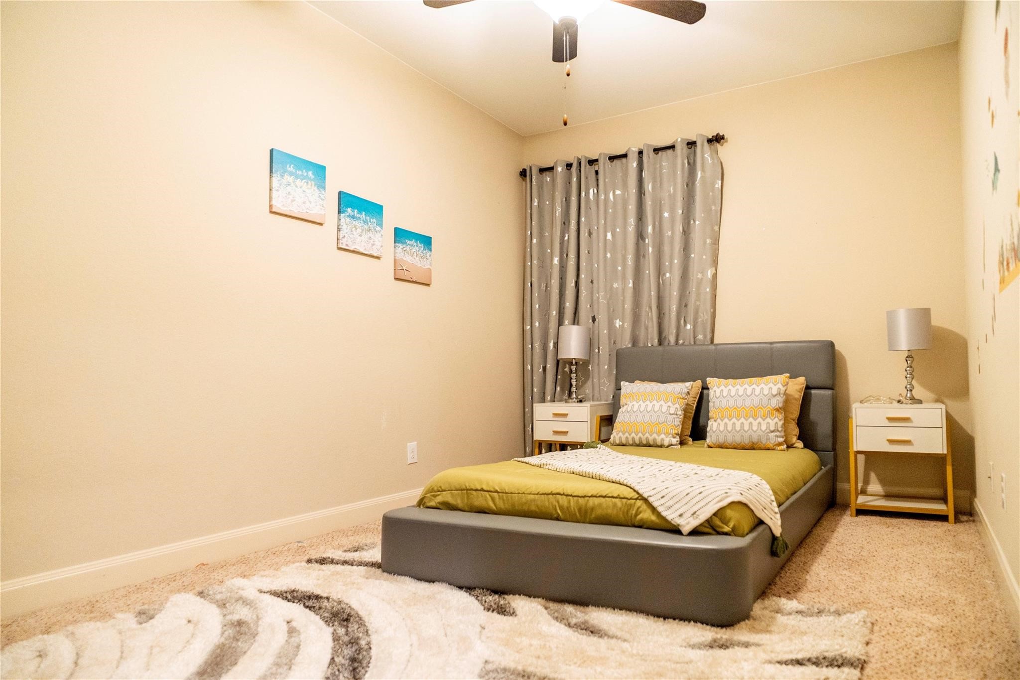 2727 Richmond Ridge Lane Katy, TX 77494 - Photo 45 of 50 a bedroom with a large bed and a chandelier