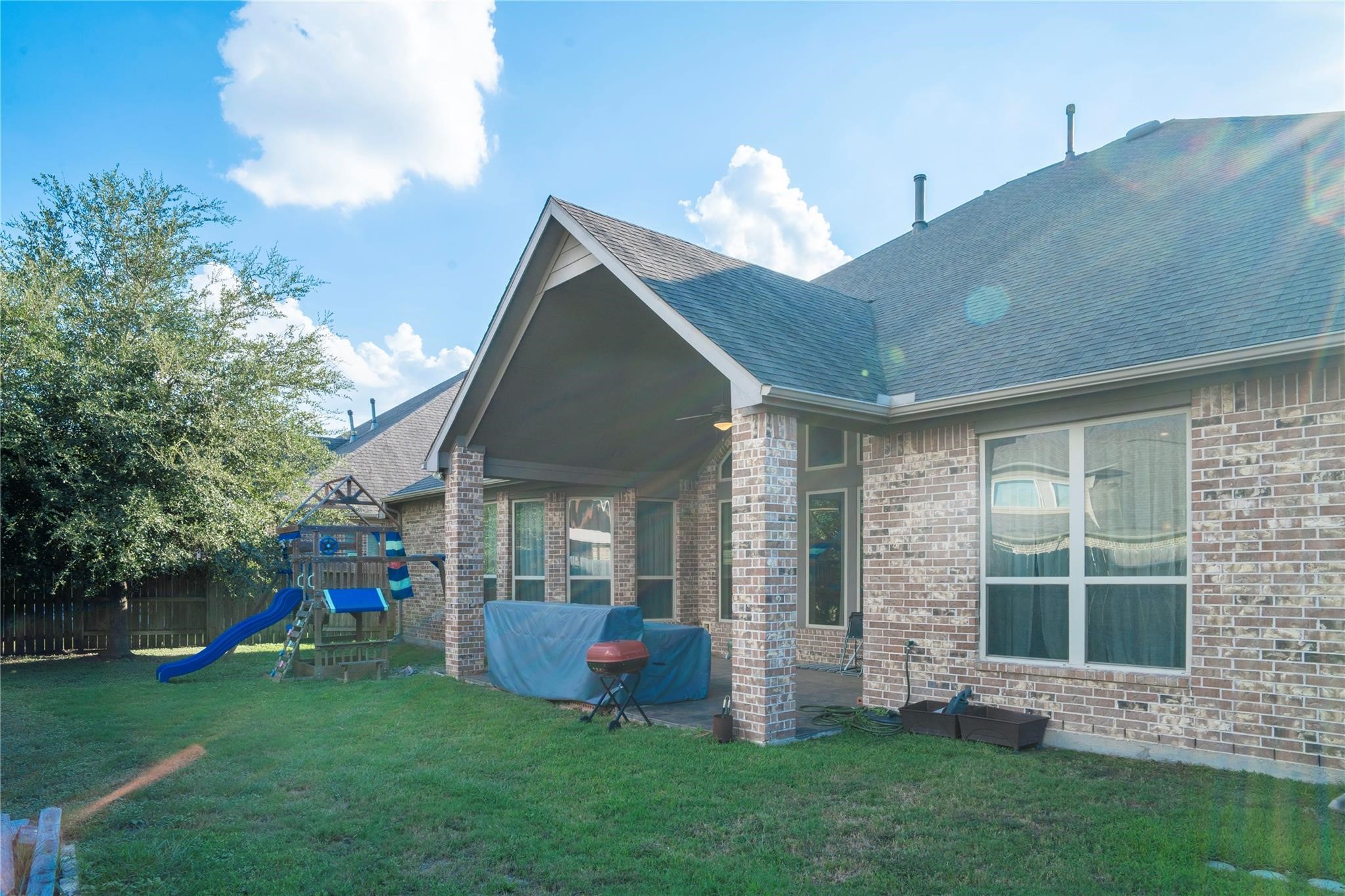 2727 Richmond Ridge Lane Katy, TX 77494 - Photo 47 of 50 a view of a house with a yard and sitting area