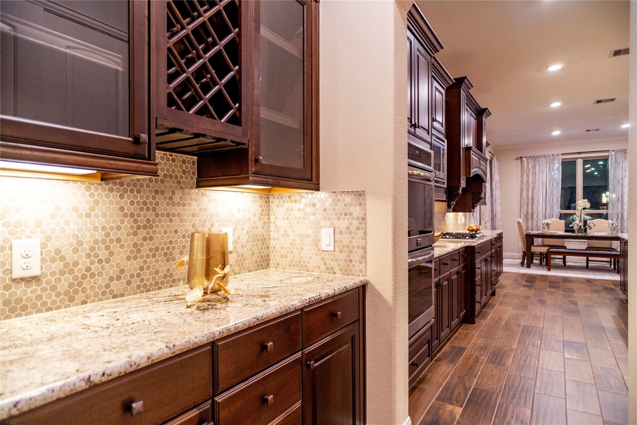 2727 Richmond Ridge Lane Katy, TX 77494 - Photo 7 of 50 a kitchen with stainless steel appliances granite countertop a sink stove and wooden floor