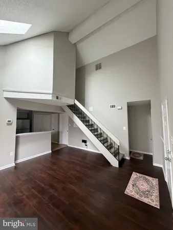 a kitchen with stainless steel appliances a refrigerator and a stove top oven