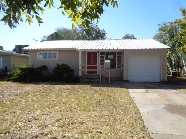 4919 38th Street Lubbock, TX 79414 - Photo 1 of 12 a front view of a house with garden