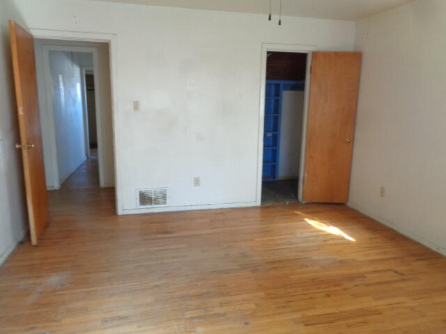 4919 38th Street Lubbock, TX 79414 - Photo 5 of 12 a view of empty room with wooden floor