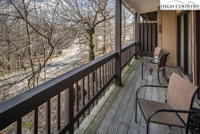 a view of balcony with furniture