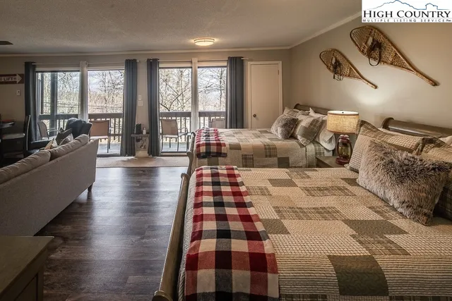 a bedroom with a large bed and a large window