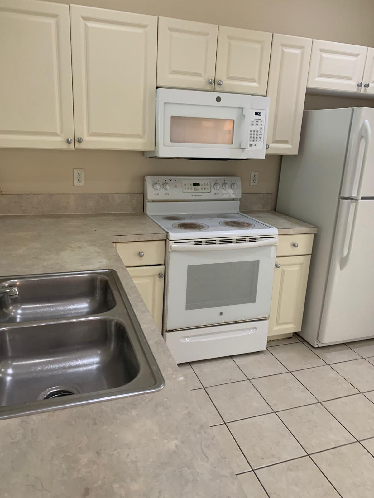 1966 Freeport Drive, Unit 1966 Riviera Beach, FL 33404 - Photo 2 of 7 PHOTO-2025-10-31-17-25-17