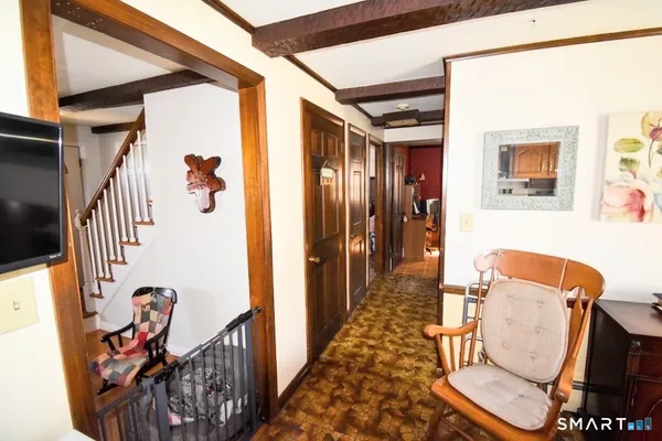a view of an entryway with wooden floor