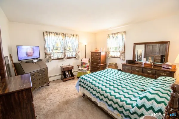 a bed room with a bed and furniture